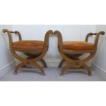 A pair of early 20thC Empire style mahogany window seats with horizontal railed flanks and stud
