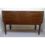 A William IV mahogany Pembroke table, the top with round corners and a reeded edge,