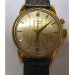 A Vulcan Cricket gold plated stainless steel cased wristwatch, faced by a striped baton dial,