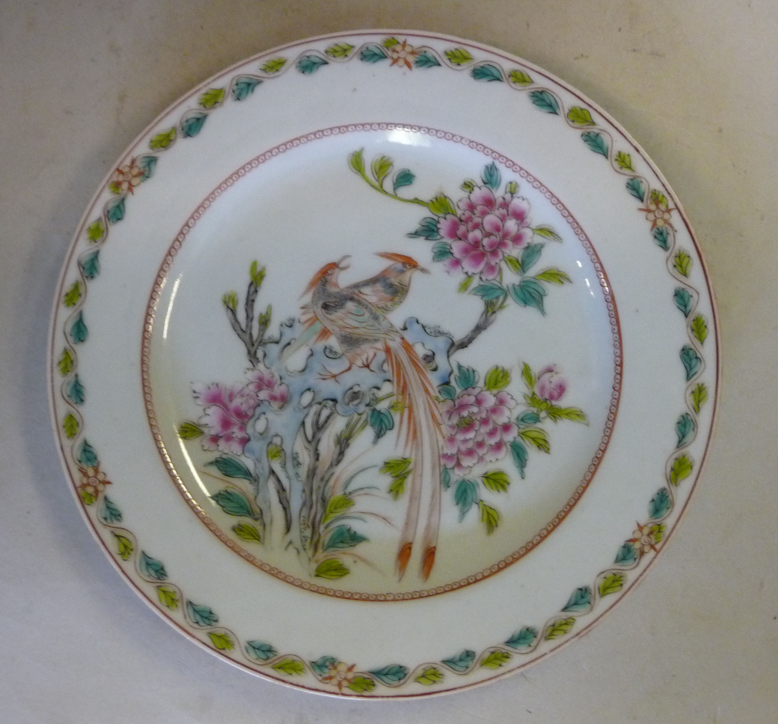 A mid 19thC Chinese porcelain dish with a wrythen moulded border and wavy edge,