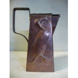 An Arts & Crafts copper jug of tapered square box design with a rivetted, angular loop handle,