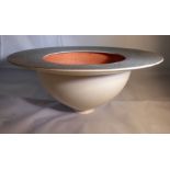 A Rosalind Rosenblatt studio pottery bowl of tapered form, decorated in tones of white,