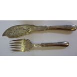 A pair of early Victorian silver fish servers with bright-cut engraved ornament,