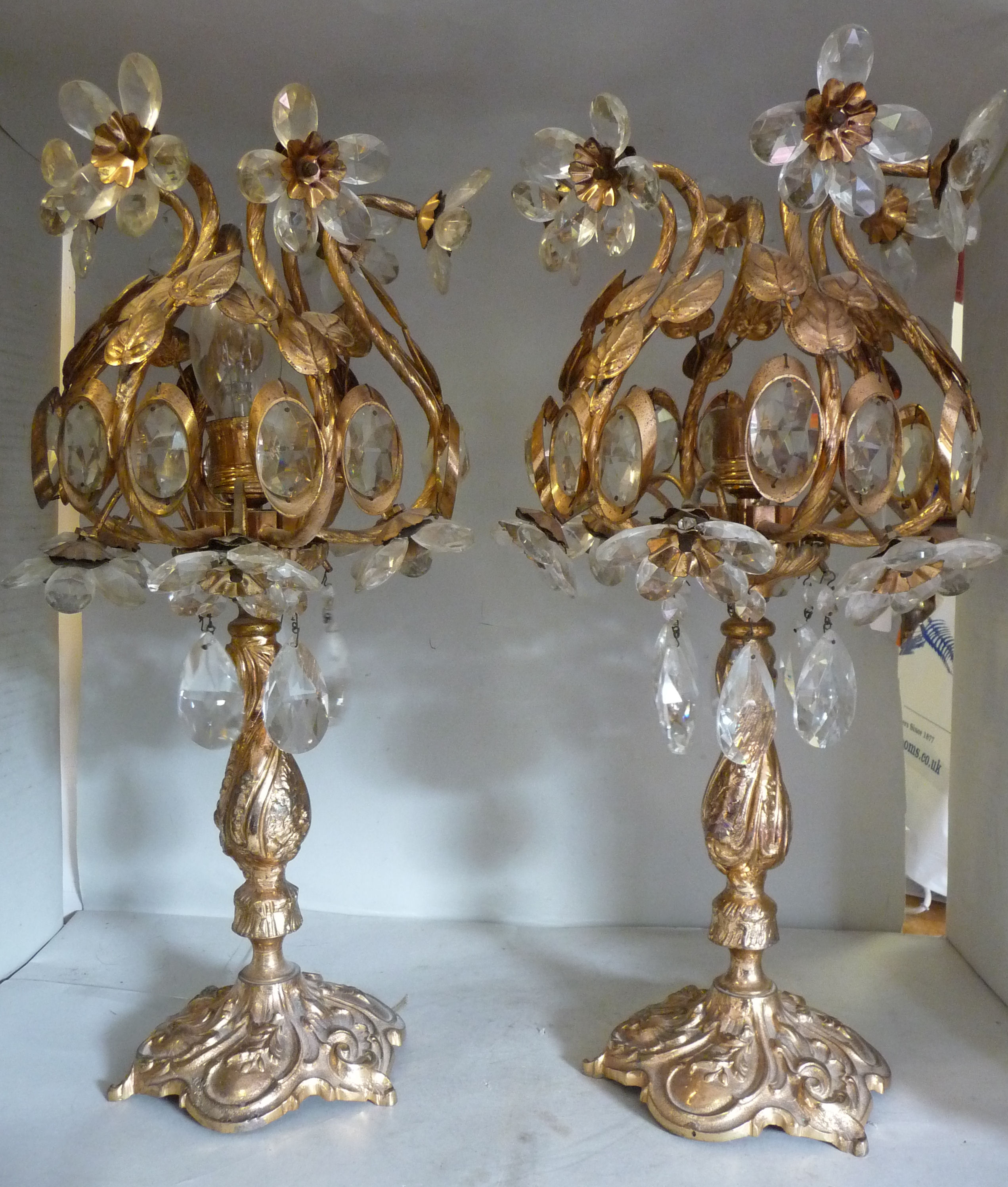A pair of 20thC Continental gilded metal and cut crystal table lamps,