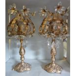 A pair of 20thC Continental gilded metal and cut crystal table lamps,