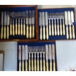 An early 20thC set of eighteen engraved silver plated dessert knives and forks,