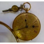 An 18ct gold cased fob watch with engine turned and foliate engraved ornament,