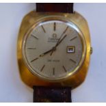 An Omega de Ville gold plated square cased wristwatch, faced by a baton dial with a date aperture,