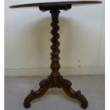 A mid 19thC French walnut pedestal table, the tip-top with a reeded edge,