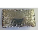 An Edwardian silver folding notelet/postage stamp case with scroll moulded borders and bright cut