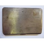 A silver folding cigarette case with engine turned ornament,