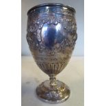 A mid Victorian silver goblet vase of ovoid form, cast, embossed and chased with flora,