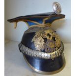 A reproduction of an Imperial Russian Cavalry Lancers helmet with an applied badge