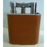 A 1940s Dunhill silver plated and tan coloured snakeskin clad,