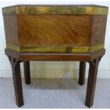 A George III mahogany wine cooler of elongated octagonal, straight sided form with a zinc liner,