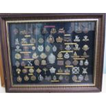 Sixty-nine military cap badges for regiments who served with the Home Guards, some copies,