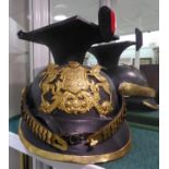 A reproduction of a German Uhlans lancer cap with a mortar board top and an applied metal badge