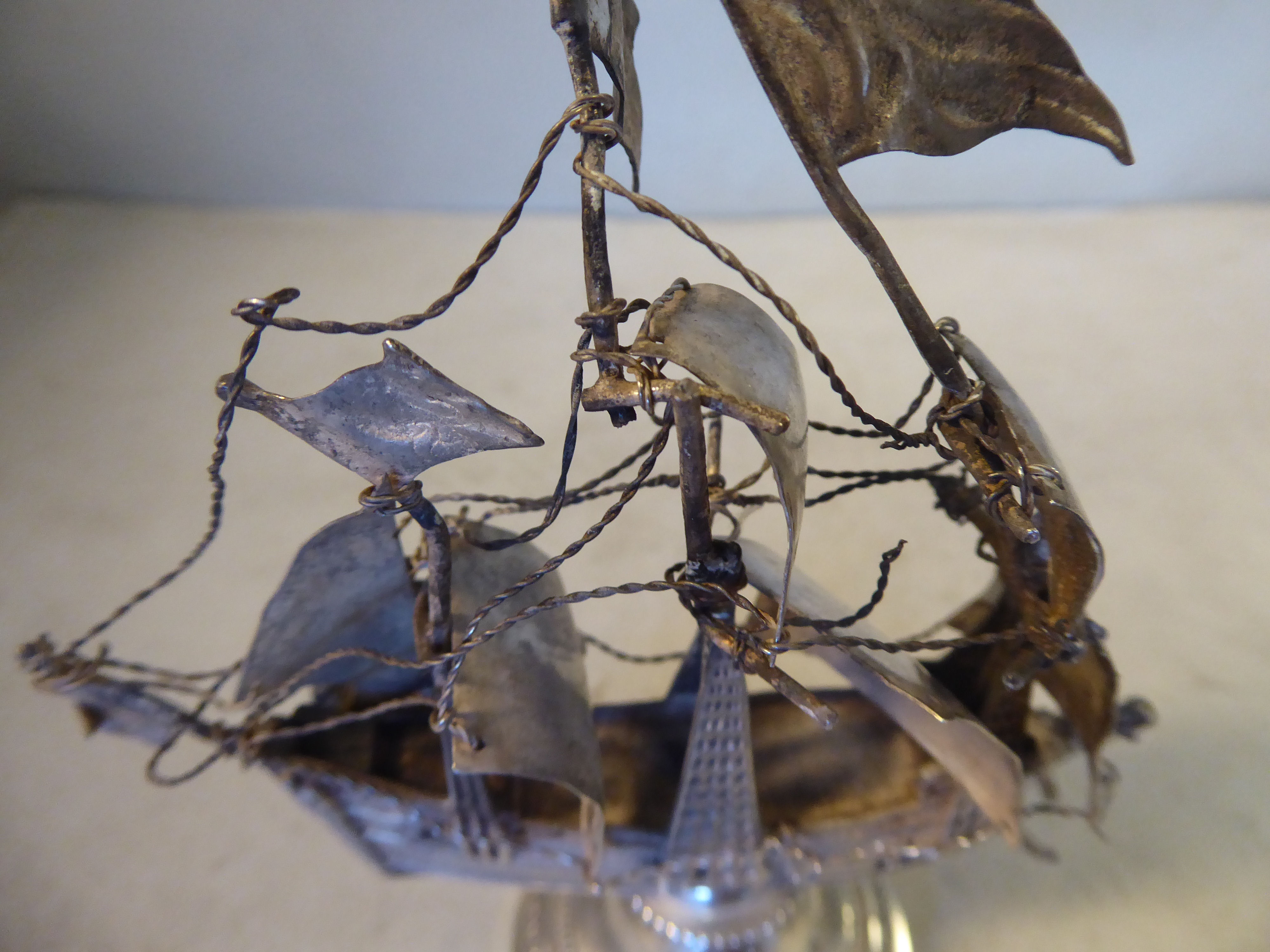 An early 20thC silver coloured metal model, a triple masted galleon with sails and rigging, - Image 3 of 4