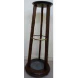 A late 19thC mahogany circular stickstand, the turned shelf top,