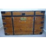 An early 20thC Naval chest with straight sides and a hinged lid, enclosing an arrangement of cases,