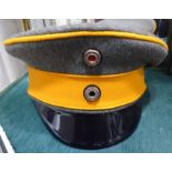 A reproduction of an Imperial German officers grey and orange peaked cap