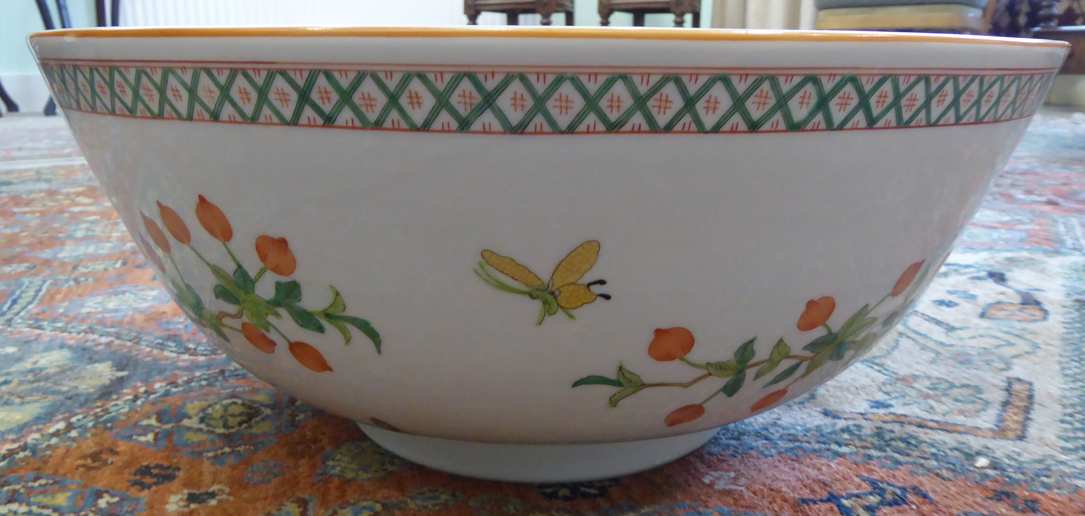 A modern Chinese porcelain bowl, decorated with insects, flora,