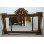 A Regency style mirror, the three bevelled plates, set in an arched and inverted,