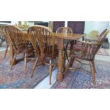 A Stewart Linford ash and elm refectory style dining table,