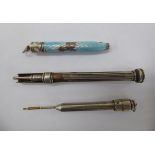 Three white metal cased pencils,