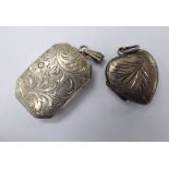 Two similar 'antique' white metal pendant lockets 11