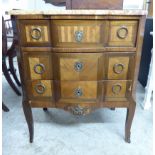 An early 20thC French kingwood and mahogany veneered commode with a mottled yellow marble top,