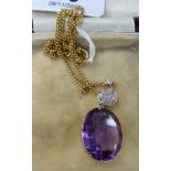 A 15ct gold chain with a diamond and amethyst pendant 11