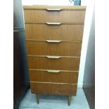 A 1970s Austinsuite teak tallboy, the six drawers with moulded, scrolled bar handles,