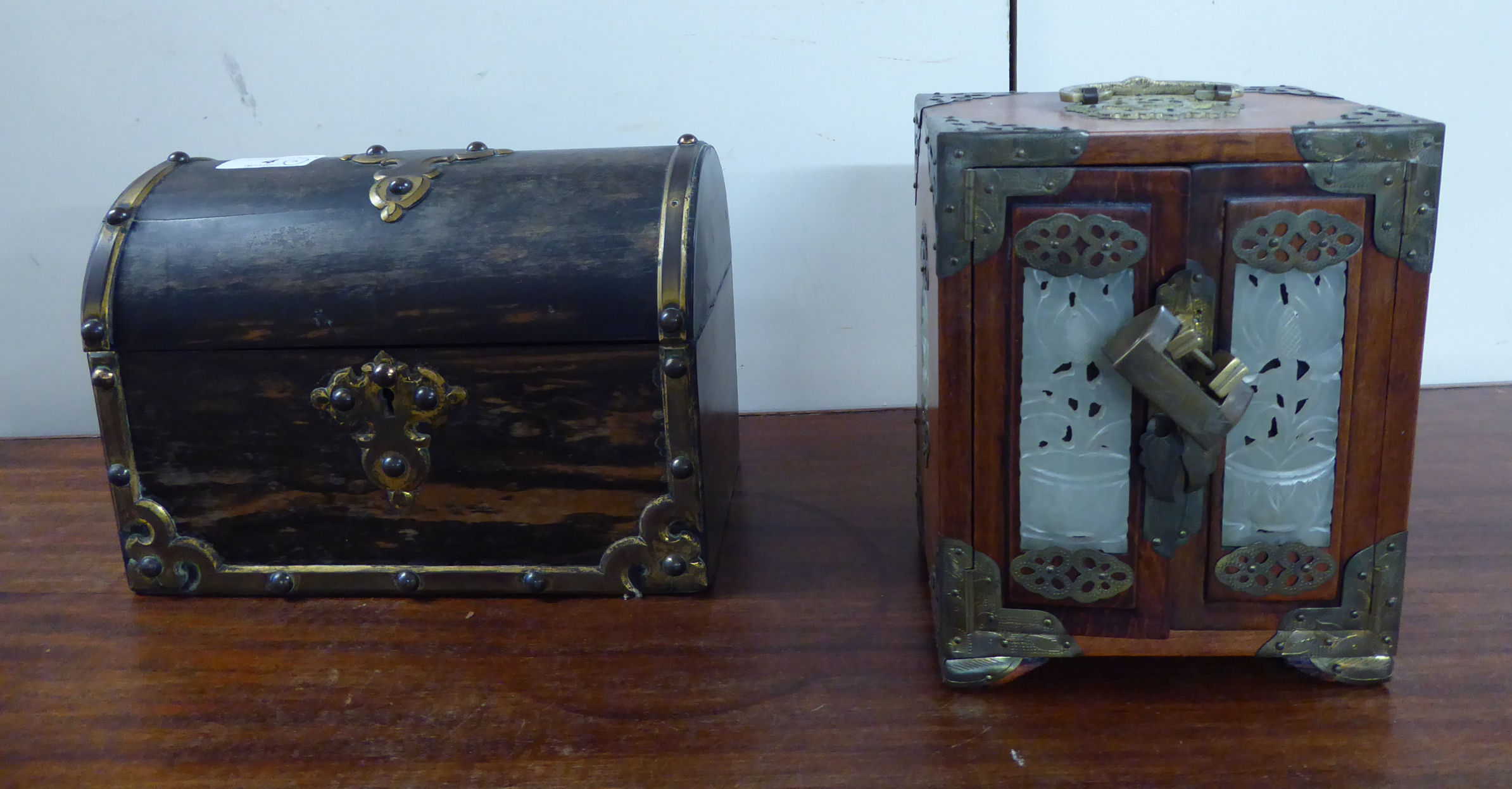 A late 19thC coromandel and brass mounted letter box of casket design with a hinged lid,