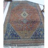 A Caucasian rug with a graduated set of three central diamond motifs,