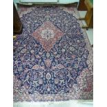 A Persian rug with a central serpentine outlined diamond motif,