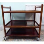 A 1970s Silkeborg rosewood three tier tea trolley with turned uprights,