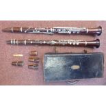 Two similar early 20thC E Albert and BA Chapple fruitwood clarinets with silver plated mounts,