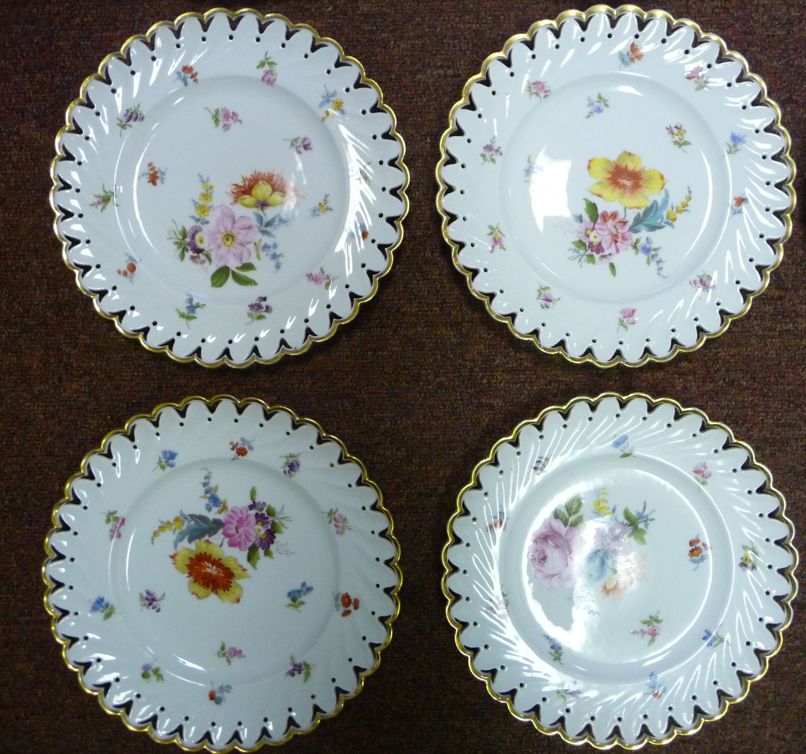 A set of nine early 20thC Continental ivory glazed porcelain dessert plates with thumb moulded, - Image 3 of 11