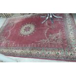 A Persian rug, the central circular medallion with a wavy edge,
