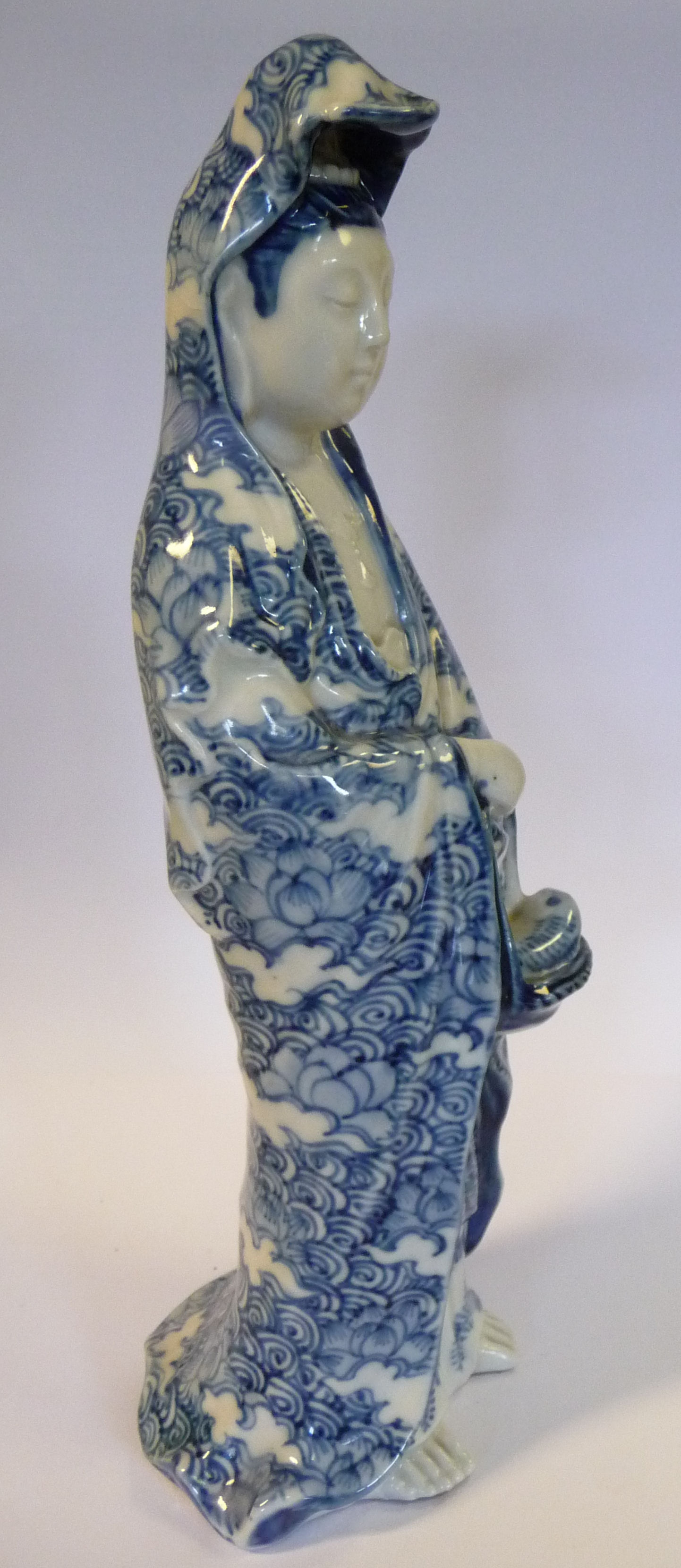 An early 20thC Chinese porcelain standing figure, Guan Yin, holding a basket of fish, - Image 7 of 11