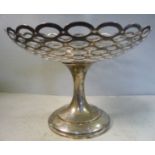 A silver cake basket with pierced, concentric ornament,