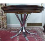 A 1970s Dyrlund 'Lotus Flip-Flap' rosewood extendable dining table,