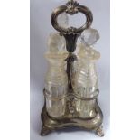 A William IV silver cruet stand with a fixed central handle and four divisions,