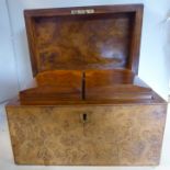 A mid 19thC figured walnut veneered tea casket with straight sides and a lockable hinged lid,