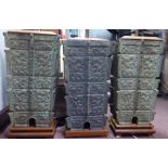 A pair of 1950/60s and one matched Chinese patinated green bronze and hardwood mounted,