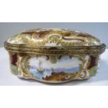 A late 19thC German porcelain serpentine front trinket box with a gilt metal mount and hinged lid,