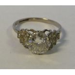 An Art Deco platinum single stone, claw set diamond ring,