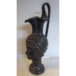 A late 19thC black painted cast bronze copy of an 'antique' Middle Eastern ewer,