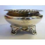 A William IV silver and parcel gilt circular salt cellar of bowl design with an everted,